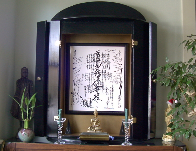 Taho Buddha stands on the left, the Eternal Sakyamuni meditates under my Gohonzon & Kwan-yin is on the right