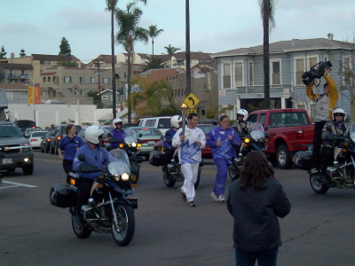 The Olympic Torch on its way to Salt Lake City passes by Don's home.