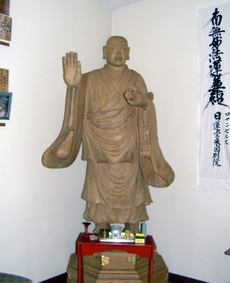 Life-size statue of Nichiren in foyer of temple