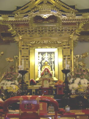 Main altar flush with flowers and fruit in offering to the Gohonzon for the Higan Ceremony [celebrating the Vernal Equinox]