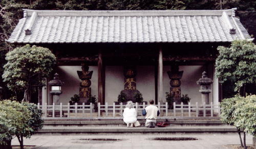 Don and fellow pilgrim chant Daimoku at the Tomb of the Three Masters